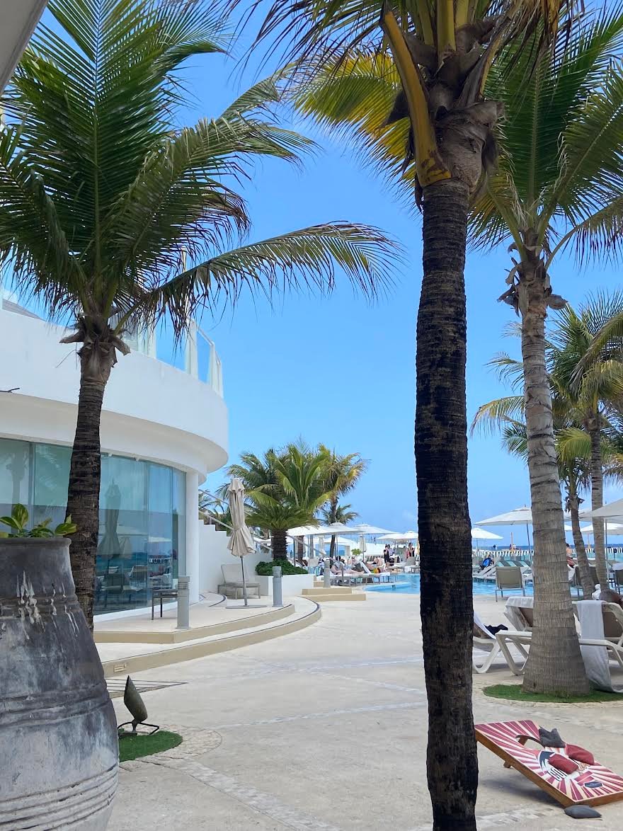 Palm-lined Palace resort pool walkway
